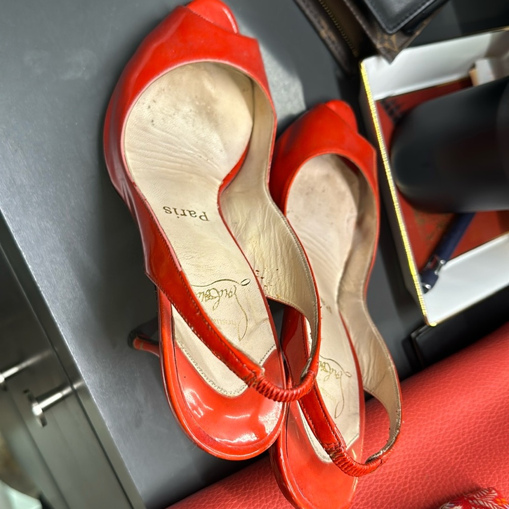 Sexy red Louboutins! Well kept bottoms